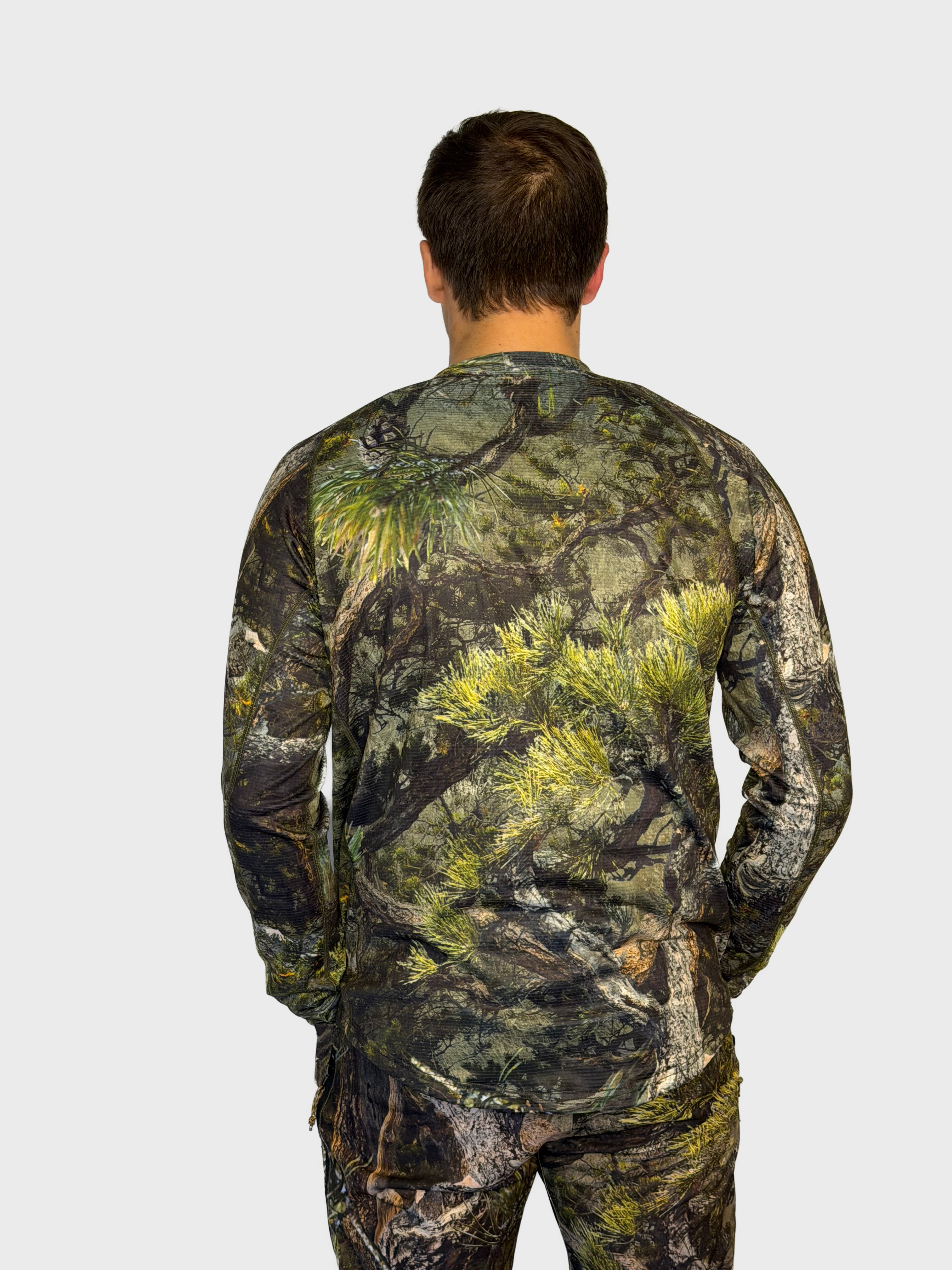 The Mid Season Long Sleeve in Pinyon camo — back view